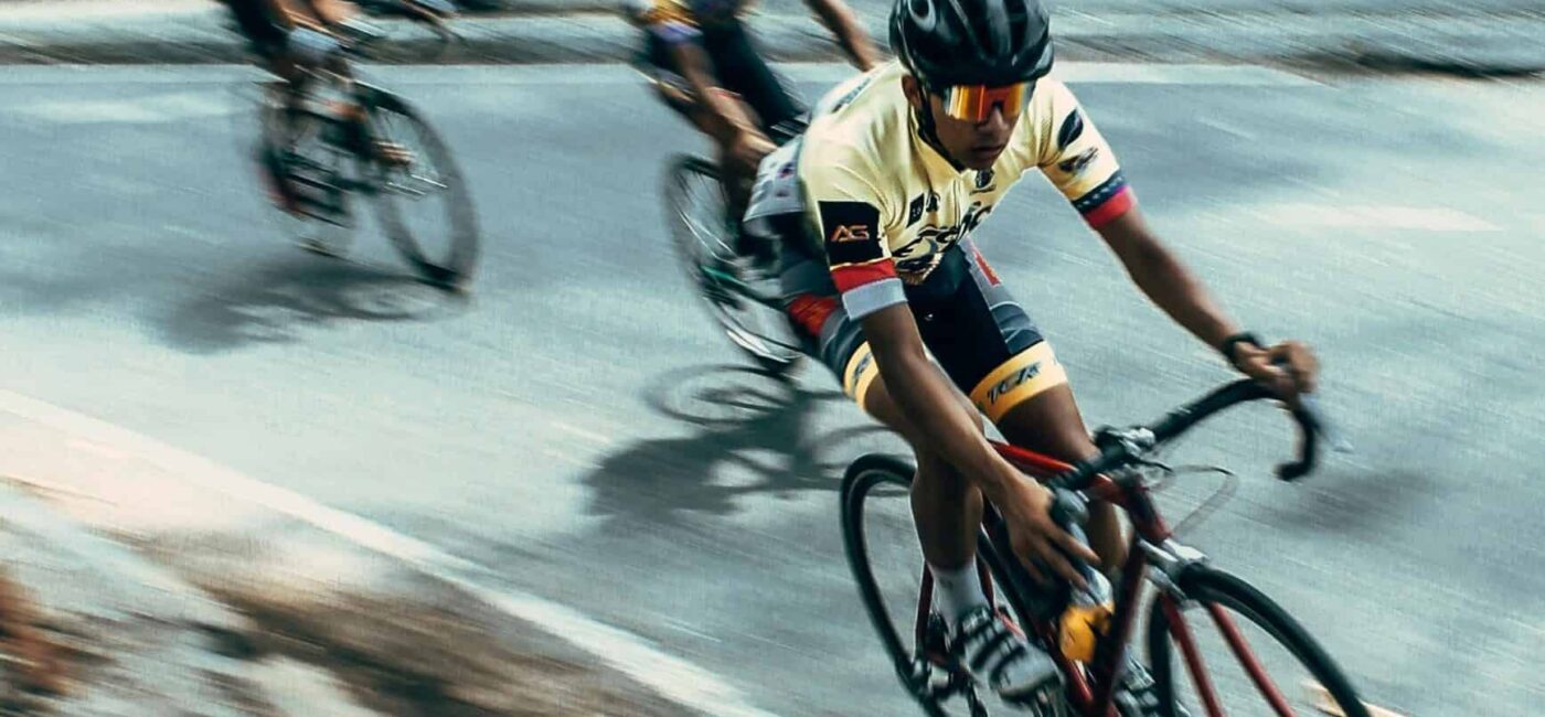 Tour de France cyclists racing through the French countryside at high speed