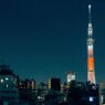 private jet landing in Tokyo with skyline view