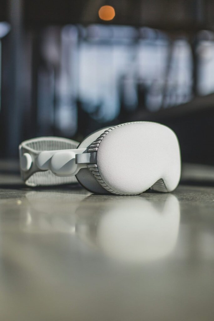 Person wearing Apple Vision Pro working productively with virtual screens floating around modern home office fashion magazine aesthetic