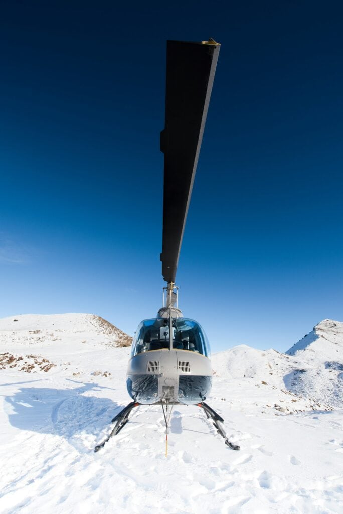 Zurich to St. Moritz transportation options comparing helicopter, private jet, and luxury car travel