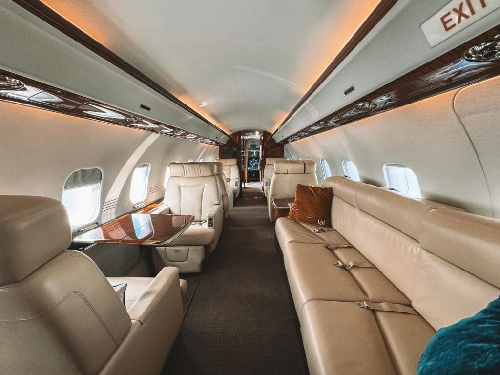 Private jet Zurich to Dubai luxury cabin interior with conference seating